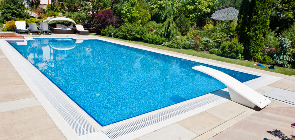 Blue pool outdoor at sunny day - Turnkey Pool Designers