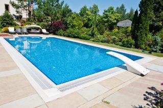 Blue pool outdoor at sunny day - Turnkey Pool Designers