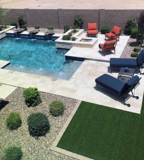 Huge Pool with Bushes and Trees on the side - Turnkey Pool Designers