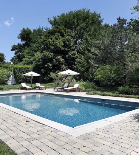 Swimming pool with deck chairs - Turnkey Pool Designers