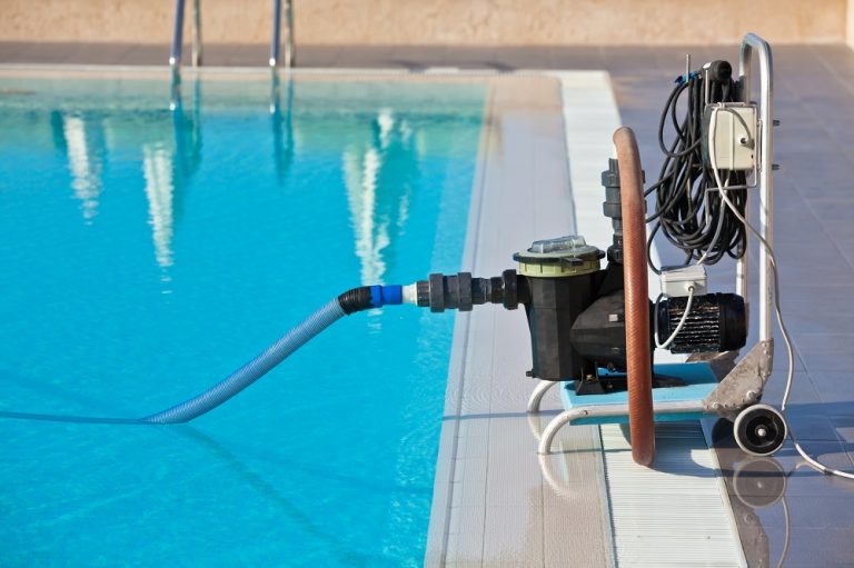 Cleaning pump working with a swimming pool. Horizontal shot
